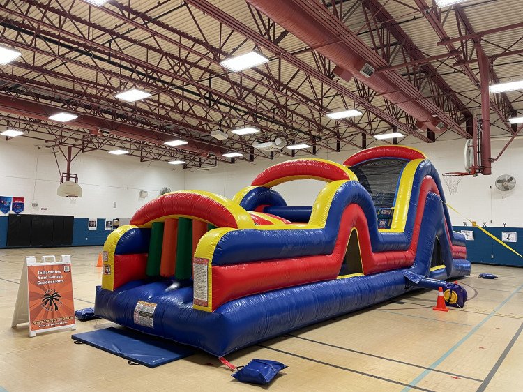 Inflatable obstacle course rental set up for a corporate team building event in Chesapeake VA