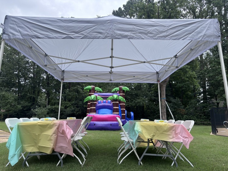 Canopy tent with tables and chairs set up for a company event in Chesapeake VA