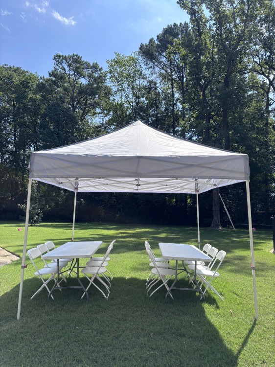 Canopy tent with tables for a shaded cool down area at a Chesapeake VA school field day